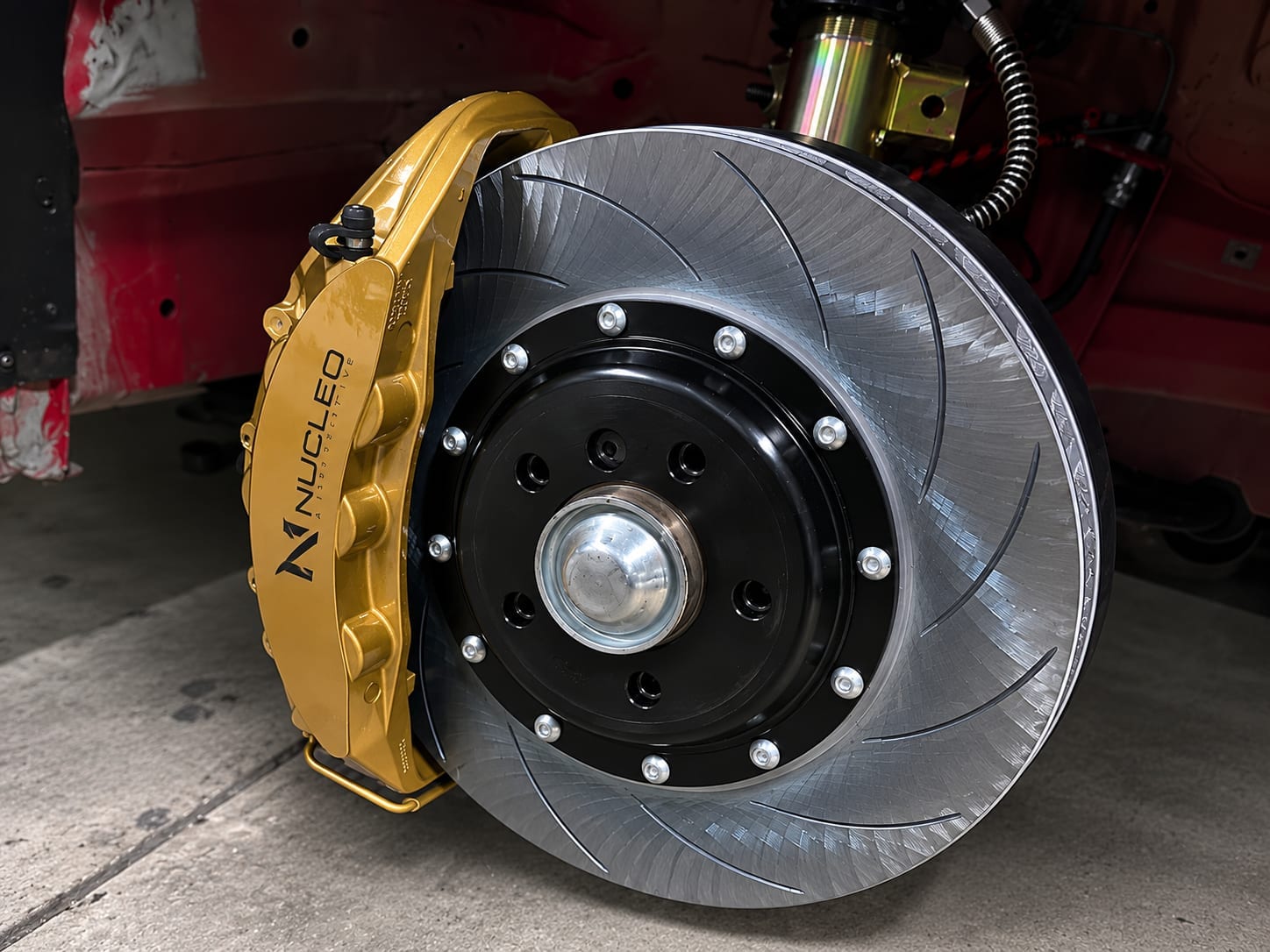 Nucleo gold caliper installed — slotted rotor